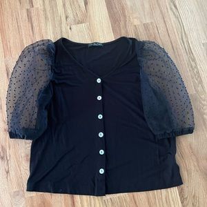 Black blouse with polka dot puff sleeves